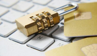 a golden padlock sitting on top of a keyboard